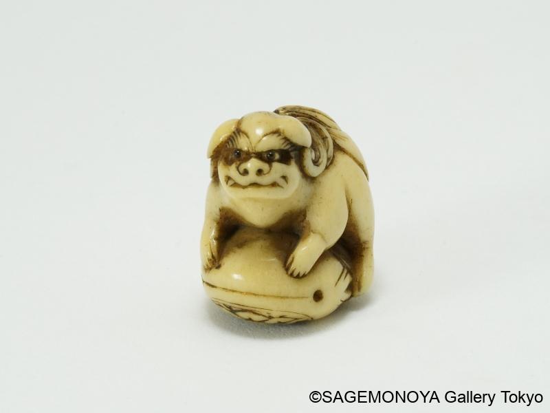 獅子に木魚－緒締｜根付専門店「提物屋」