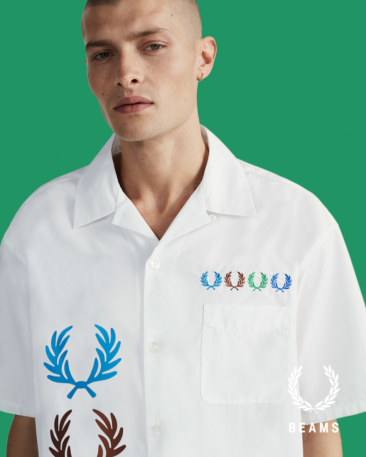 フレッドペリーがビームスと初コラボ、4色のローレルをデザイン