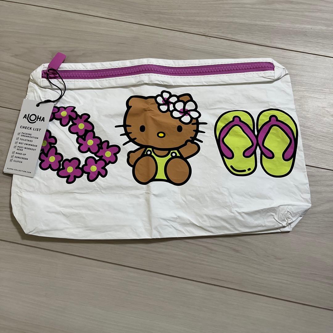 新品⭐️アロハのハワイ限定 日焼けキティのビッグポーチです - メルカリ